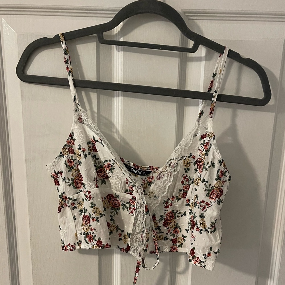 Floral printed cropped tank top, slit down the middle.